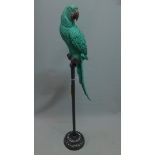 A Contemporary fibreglass model of a parrot, raised on metal stand, H. 119 cm