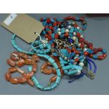 A collection of Persian necklaces and beads, to include faux pearl and turquoise necklace, a