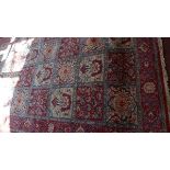 A fine Central Persian Qum carpet, floral pattern motifs with repeating petal motifs within stylised