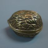 A Tiffany vermeil pill box in the form of a walnut, marked Tiffany and 925 to silver gilt