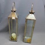 A pair of storm lanterns, H. 80cm