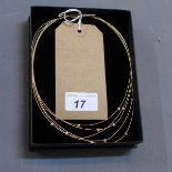 An 18ct yellow gold strand necklace mounted with diamonds