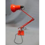 A red Herbert Terry anglepoise lamp, stamped
