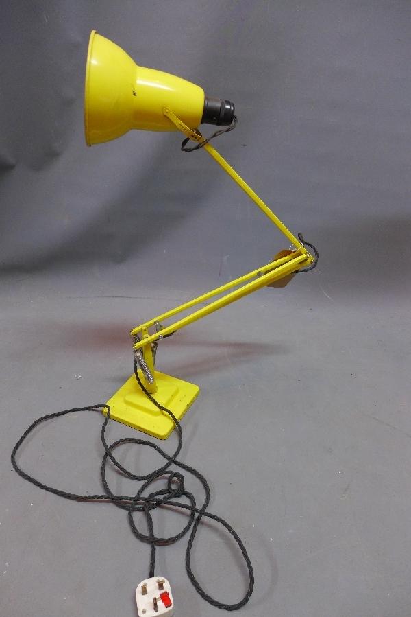 A yellow Herbert Terry anglepoise lamp, stamped