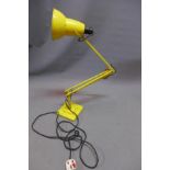 A yellow Herbert Terry anglepoise lamp, stamped