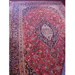 A fine Central Persian Kashan carpet, 325cm x 215cm, central Horal medallion on a rouge field within