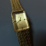 An 18ct yellow gold Omega De Ville ladies wristwatch, 17 jewel movement, the gilt dial with baton