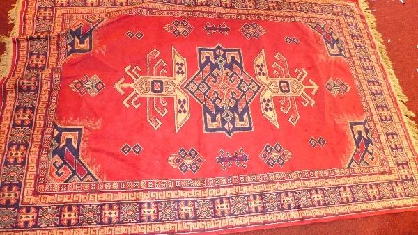 A red ground Afghan rug