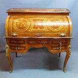 A Louis XV style walnut roll top bureau, having marquetry inlay and brass mounts, raised on cabriole