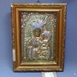 A glazed and framed Polish icon with gilt coloured sheet metal oklad, 28 x 21cm