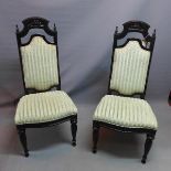 A pair of early 20th century Continental ebonised hall chairs, raised on fluted legs