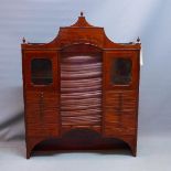 A Victorian mahogany medicine cabinet, with architectural pediment above 18 drawers having ceramic