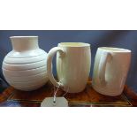 A Keith Murray, Wedgwood, white glazed vase, together with two Keith Murray mugs, (a/f)