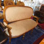 A giltwood cream upholstered sofa