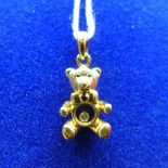 A Chopard 'Happy Diamonds' 18ct yellow gold teddy bear charm/pendant, inset with sapphire eyes, ruby