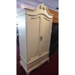 A Contemporary cream painted armoire, with two doors, above single drawer, raised on cabriole
