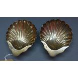 A pair of Victorian silver shell dishes, raised on ball feet, James Deakin & Sons (John & William