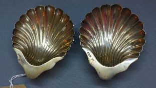 A pair of Victorian silver shell dishes, raised on ball feet, James Deakin & Sons (John & William