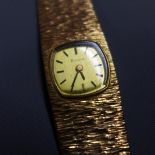A 9ct yellow gold Bulova ladies wristwatch, 17 jewel movement, the champagne dial with baton