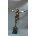 An Art Deco style bronzed sculpture of a dancing lady, raised on marble base, H.50cm