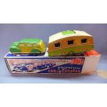 A Mettoy (UK) tinplate clockwork "Woody" Estate Car and Caravan - car is green, with detailed