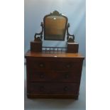 A Victorian mahogany dressing chest, with swing mirror above two short and two long drawers,