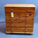 A 20th century pine chest of five drawers, raised on bun feet, H.83 W.80 D.39cm