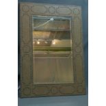 A Contemporary mirror with stud bound border, 120 x 85cm