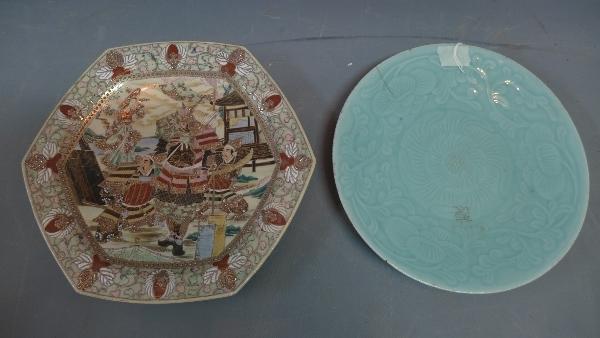 A large Japanese dish, decorated with samurai in courtyard scene, together with a celadon charger,