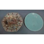 A large Japanese dish, decorated with samurai in courtyard scene, together with a celadon charger,