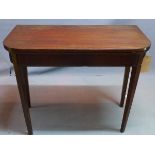 A 19th century mahogany card table, raised on tapered legs, H.74 W.92 D.46cm
