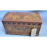 A 19th / 20th century German dome top casket, carved and painted with conker trees, raised on bun