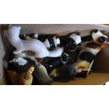 A collection of porcelain animals to include a Beswick panda, Gobel raccoon, Wade lady, Russian