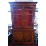 A Victorian burr walnut bookcase, with two glazed doors over two cupboard doors, having marquetry