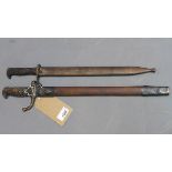 Two Third Reich style bayonets, one in scabbard bearing swastika and marked 'Bolangning' and