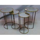 A nest of circular tables with mirrored tops