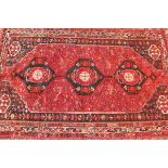 A fine North West Persian Afshar carpet, having triple pole medallion with repeating petal motifs on