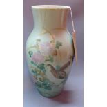 A 19th century Japanese porcelain celedon vase, decorated with birds amongst foliage, character