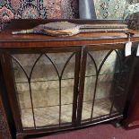 An early 20th century glass fronted display cabinet