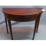 A 19th century mahogany card table, raised on tapered legs and spade feet, H.74 W.91 D.45cm