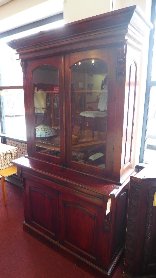 A mahogany bookcase with two glass fronted doors, H.210 W.120cm