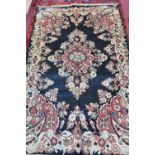 A fine North West Persian Mahal rug, central floral medallion on a midnight field within ivory