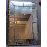 A giltwood panelled mirror with bevelled plate, 158 x 105cm