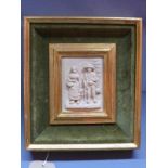 A relief moulded resin plaque depicting a rural couple with a sheep, in velour lined frame, 13 x 9cm