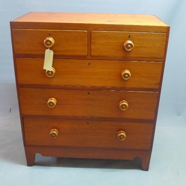A 19th century mahogany and pine chest, with two short over three long drawers, raised on bracket