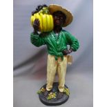 A 1950's fibre glass model of a fruit seller, H.120cm