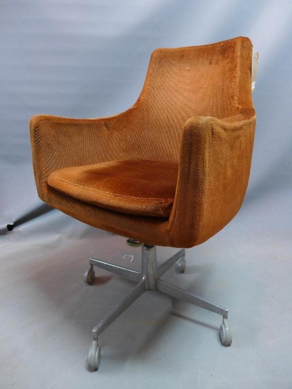 An Industrial desk chair, with brown velour upholstery