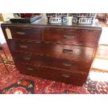 A mid 20th century mahogany chest of two short over three long drawers, raised on plinth base,