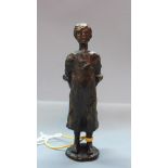 A 20th century Continental bronze figure of a young girl with a doll behind her back, 'Sophietje',