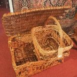 A large vintage picnic hamper, together with one other basket